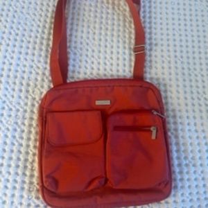 Baggallini Multi-Pocket Orange Travel Bag, approximately 8x8